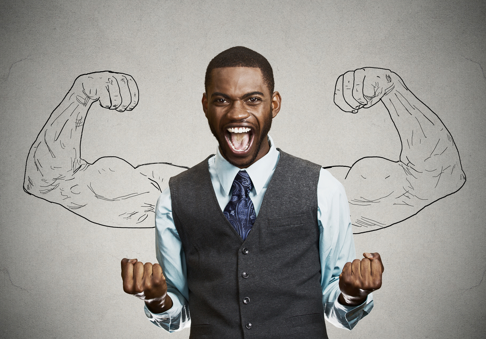 Closeup portrait happy successful student, business man winning, fists pumped celebrating success isolated grey wall background. Positive human emotion facial expression.